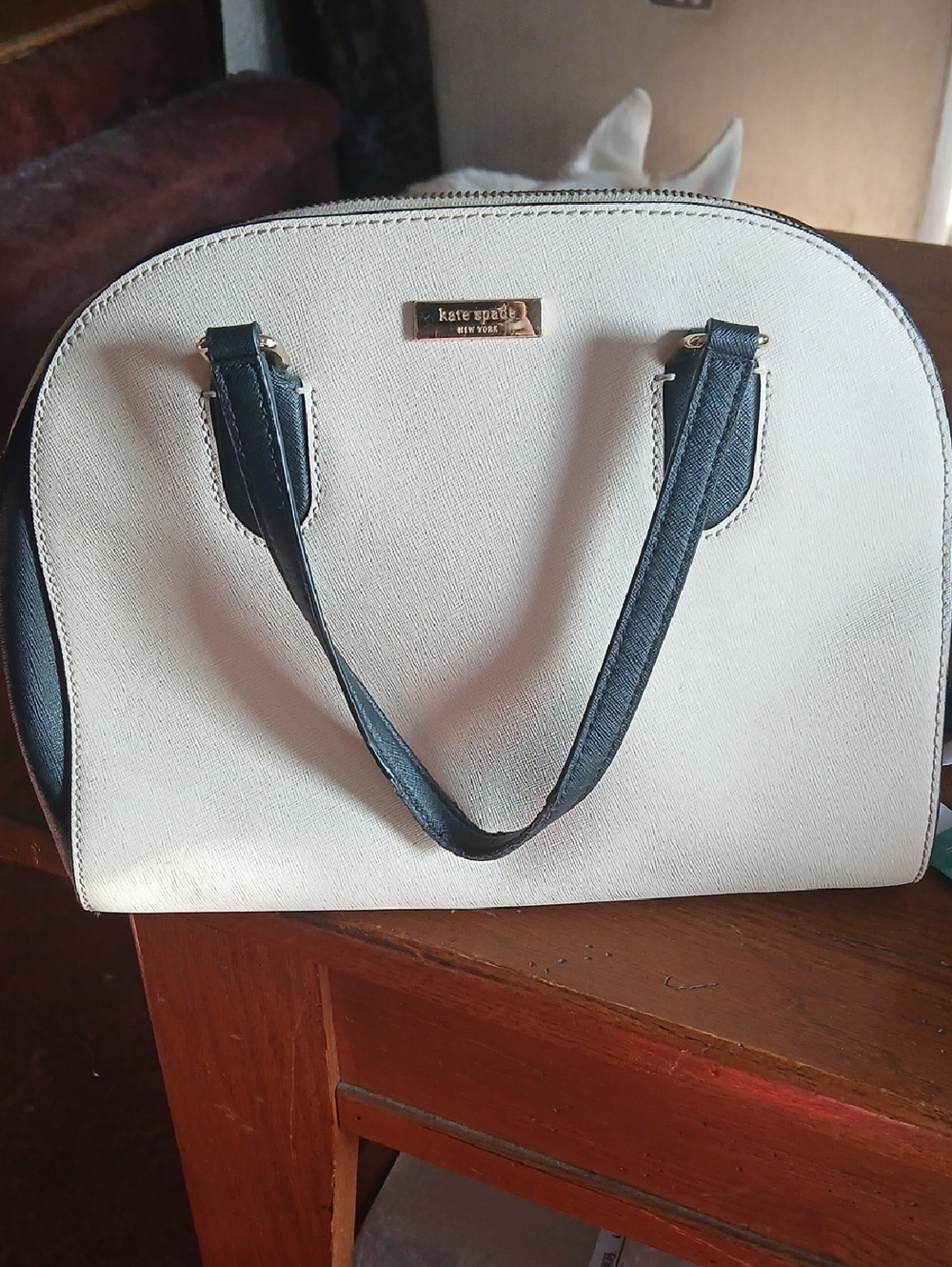 kate spade cream and black dome satchel with gold logo plate
